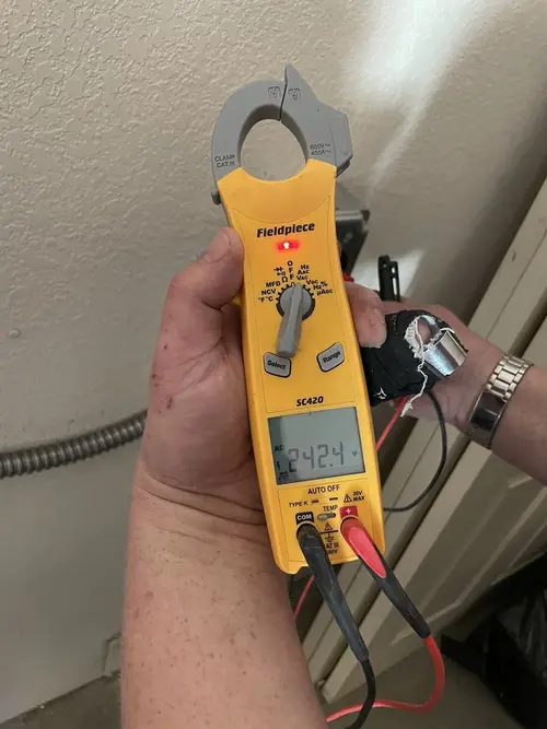 Voltage testing with clamp meter during Electrical Installation Services in East Grand Rapids